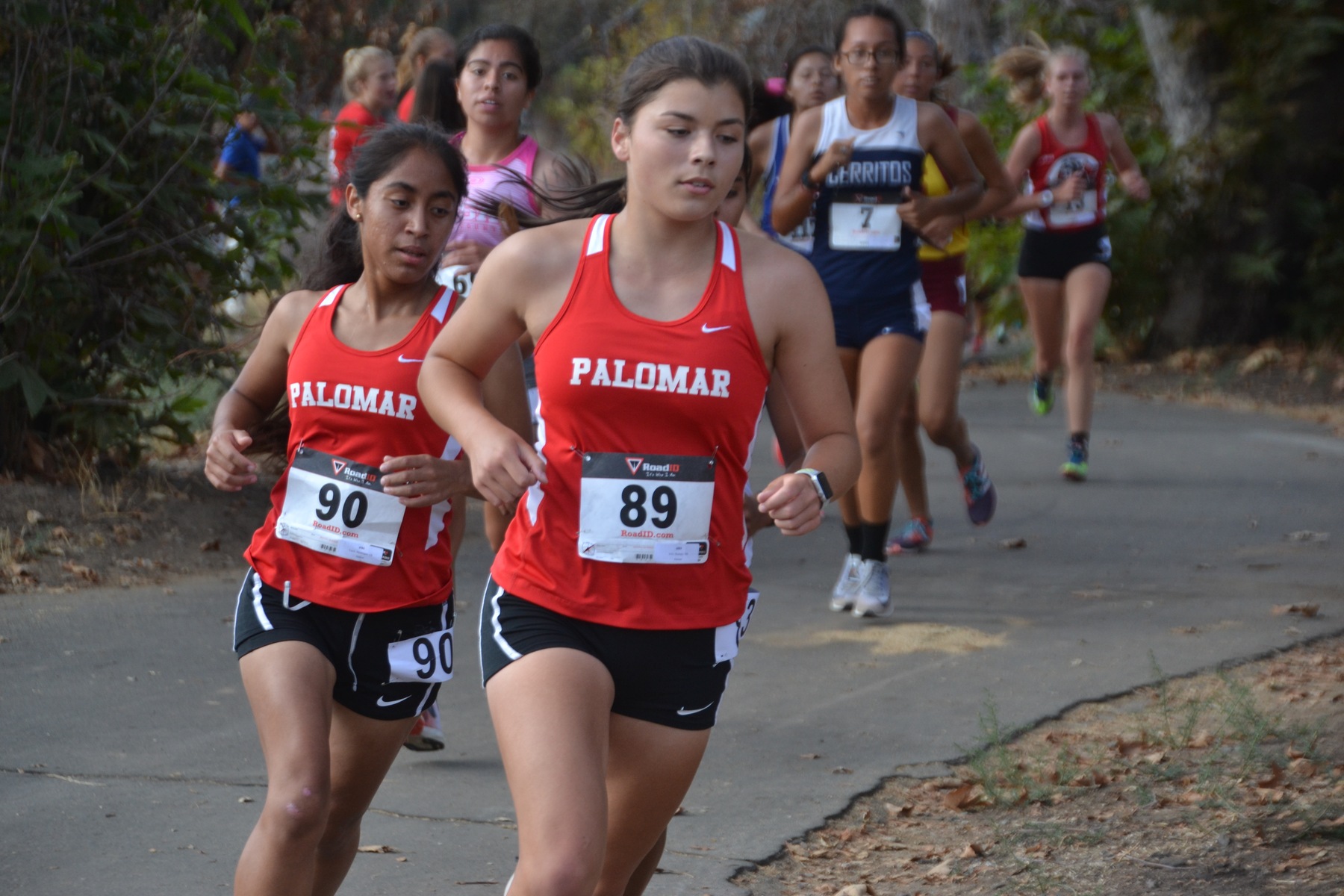 Jolie Bentjas leads teammate Lessli Maldonado in Friday's women's race.